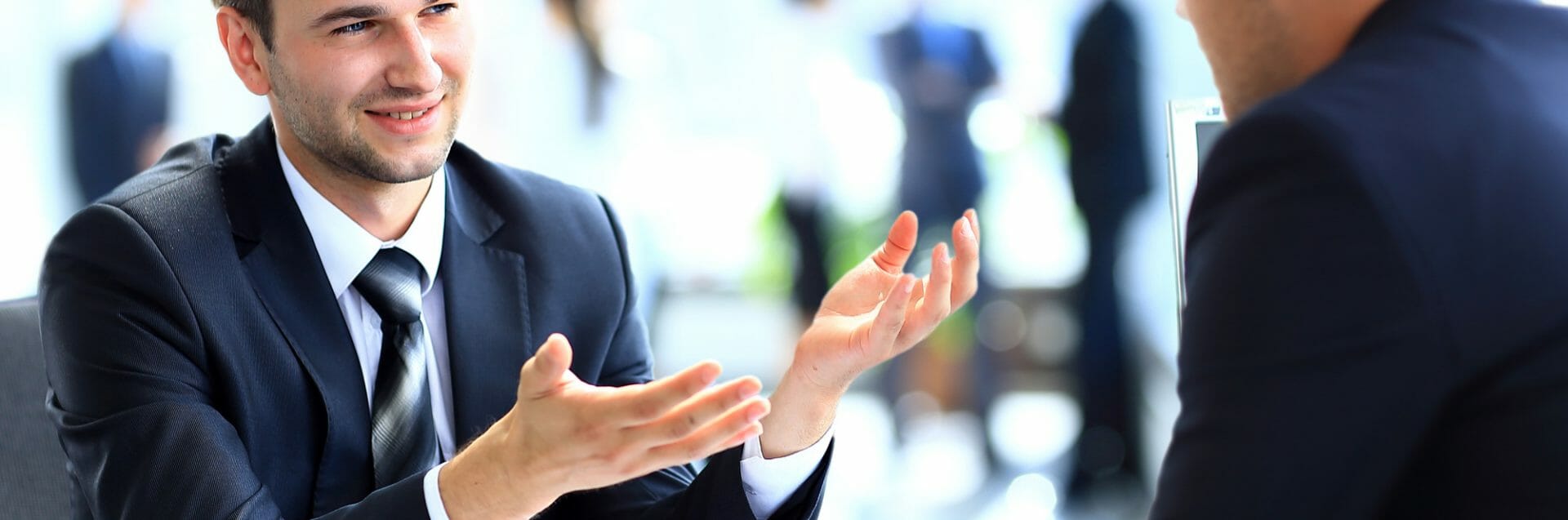 Happy business people talking on meeting at office