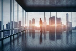 Business man in suit looking at the city