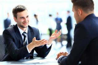 Happy business people talking on meeting at office